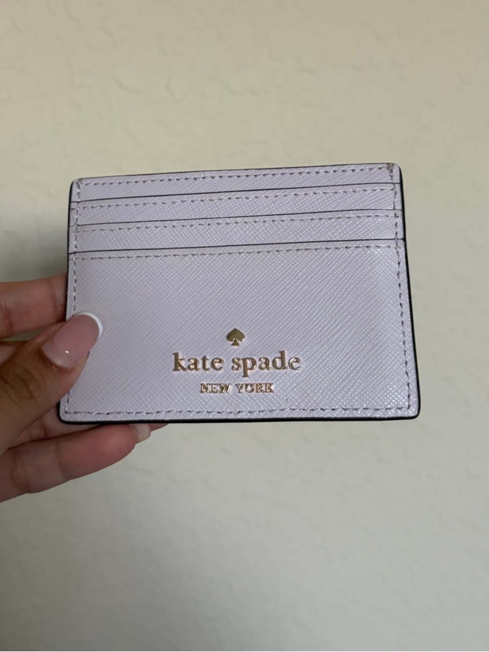 Kate Spade pale pink saffiano card case with gold logo